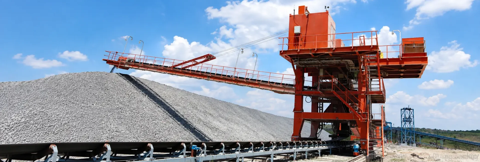 Panoramic Quarry Conveyor Under Blue Skies